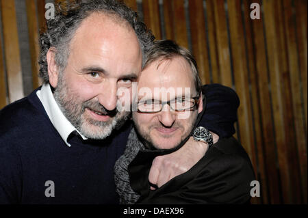 Producer Peter Rommel (L) and actor Milan Peschel smile during the premier of the movie 'Halt auf freier Strecke' ('Stop on open track') by director Andreas Dresen at the 'International' cinema in Berlin, Germany, 16 November 2011. The movie was awarded with the prize 'Un Certain Regard' during the Cannes Film Festival. Photo: Roland Popp Stock Photo