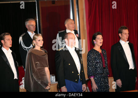 Pierre Casiraghi (L-R), Princess Charlene and Prince Albert II of Monaco, Princess Caroline of Hanover and Andrea Casiraghi sing at the beginning of the gala evening at the end of the Monaco National Day at the Grimaldi Forum in Monte Carlo, Monaco, 19 November 2011. Photo: Albert Nieboer / NETHERLANDS OUT Stock Photo