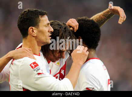 Stuttgart's Martin Harnik (C) celebrates his 1-0 goal with team mates Khalid Boulahrouz (L) and Cacau (R) during the German Bundesliga first division soccer match between VfB Stuttgart and FC Augsburg at the Mercedes-Benz Arena in Stuttgart, Germany, 20 November 2011. Stuttgart wins the match 2-1. Photo: Bernd Weissbrod  (ATTENTION: EMBARGO CONDITIONS! The DFL permits the further   Stock Photo