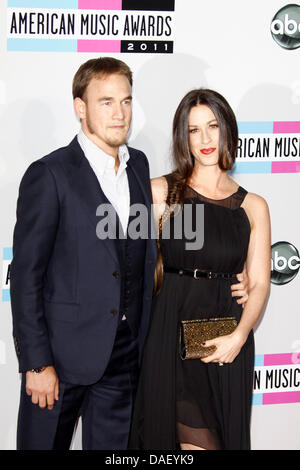 Singer Alanis Morisette and Mario ÒMC SouleyeÓ Treadway arrive at the 2011 American Music Awards at Nokia Theatre L.A. Live in Los Angeles, USA, on 20 November 2011. Photo: Hubert Boesl Stock Photo