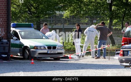 (file) - A dpa file picture dated 25 April 2007 shows forensic specialists at work at the crime scene where a policewoman was shot and a fellow officer badly wounded in Heilbronn, Germany. The police now believe there might be a more intimate connection between the slain police officer and the neo-nazi terrorist cell that was recently uncovered. The act might have been a planned ki Stock Photo