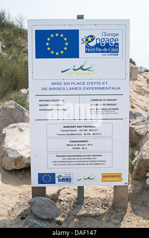 EEC sign giving details of experimental breakwater installed on the beach at Wissant in Northern France Stock Photo