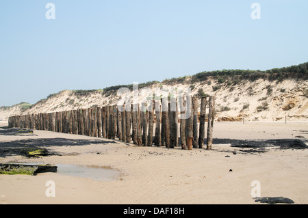 Experimental breakwater installed on the beach at Wissant in Northern France Stock Photo