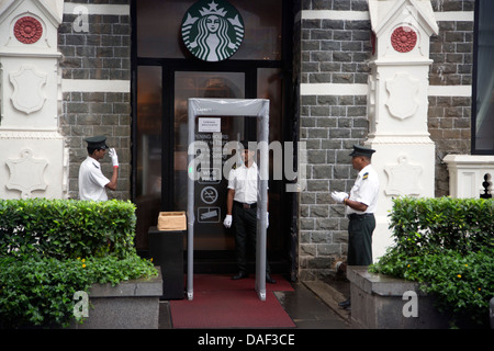 Starbucks Coffee house security entrance at rear of Taj Mahal Palace hotel in mumbai Stock Photo