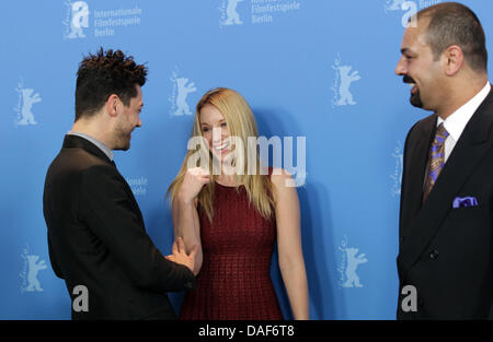 British actor Dominic Cooper, French actress Ludivine Sagnier and Iraqi author Latif Yahia poses at a photocall for the film 'The Devil's Double' during the 61st Berlin International Film Festival in Berlin, Germany on 11 February 2011. The film is running in the section Panorama special of the International Film Festival. The 61st Berlinale takes place from 10 to 20 February 2011. Stock Photo