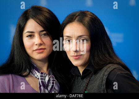 Turkish-born German director Yasemin Samdereli (R) and Turkish-born German scriptwriter Nesrin Samdereli pose during the photocall for the film 'Almanya' ('Almanya - Willkommen in Deutschland') during the 61st Berlin International Film Festival in Berlin, Germany, 12 February 2011. The film is running in the section competition out of competition of the International Film Festival. Stock Photo