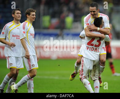 Leverkusen's Stefan Reinartz (L-R), Daniel Schwaab, Renato Augusto and Arturo Vidal cheer after Augusto's 2-0 goal during the Bundesliga match Eintracht Frankfurt vs. Bayer 04 Leverkusen at the Commerzbank Arena in Frankfurt Main, Germany, 12 February 2011. Leverkusen won 3-0. Photo: ARNE DEDERT (ATTENTION: EMBARGO CONDITIONS! The DFL permits the further utilisation of the pictures Stock Photo