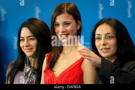 Turkish-born German scriptwriter Nesrin Samdereli (L-R), German actress Aylin Tezel and poses Turkish-born German director Yasemin Samdereli pose during the photocall for the film 'Almanya' ('Almanya - Willkommen in Deutschland') during the 61st Berlin International Film Festival in Berlin, Germany, 12 February 2011. The film is running in the section competition out of competition Stock Photo