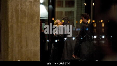 Pop singer Madonna hugs a man at Soho House Berlin, a private members  club with 40 bedrooms, 12 February 2011. US pop singer Madonna will present footage from her film 'W.E.' to overseas distributors beside the 61st Berlinale running from 10 to 20 February. Madonna is expected to stay at Soho House. Photo: Arno Burgi dpa Stock Photo