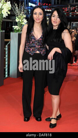 Turkish-born German director Yasemin Samdereli (L) and Turkish-born German scriptwriter Nesrin Samdereli arrive for the premiere of the film 'Almanya' ('Almanya - Willkommen in Deutschland') during the 61st Berlin International Film Festival in Berlin, Germany, 12 February 2011. The film is running in the section competition out of competition of the International Film Festival. Th Stock Photo