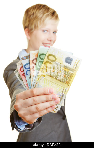 Young happy woman holding a fan of euro money bills Stock Photo