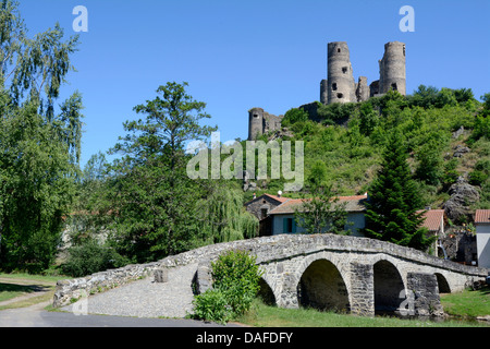 Old stone bridge in front of Château de Domeyrat castle, Domeyrat, Haute-Loire, Auvergne, France, Europe Stock Photo