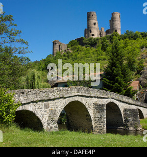 Old stone bridge in front of Château de Domeyrat castle, Domeyrat, Haute-Loire, Auvergne, France, Europe Stock Photo