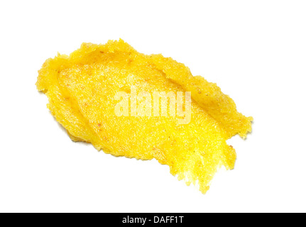 beige yellow body scrub paste cut out onto a white background Stock Photo