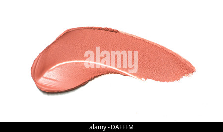 sweep of pink/red creamy blusher/lipstick cut out onto a white background Stock Photo