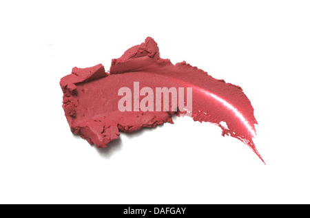 sweep of pink/red creamy blusher/lipstick cut out onto a white background Stock Photo
