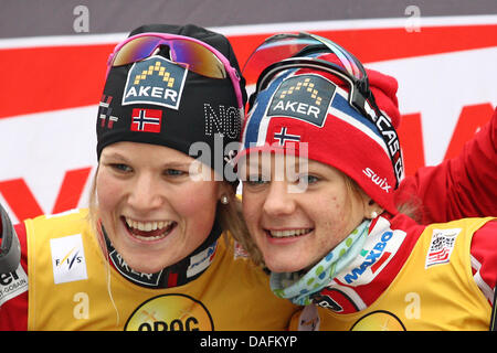 Norway's Mari Eide (L) and Maiken Caspersen Falla celebrate their win in the team sprint race of the Cross-country skiing World Cup in Duesseldorf, Germany, 04 December 2011. Photo: Kevin Kurek Stock Photo