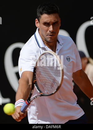 Stuttgart, Germany. 12th July, 2013. Rumanian tennis player Victor Hanescu plays the ball during the quarter final against Paire from France at the ATP Tournament in Stuttgart, Germany, 12 July 2013. Photo: MARIJAN MURAT/dpa/Alamy Live News Stock Photo