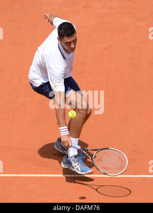 Stuttgart, Germany. 12th July, 2013. Rumanian tennis player Victor Hanescu plays the ball during the quarter final against Paire from France at the ATP Tournament in Stuttgart, Germany, 12 July 2013. Photo: MARIJAN MURAT/dpa/Alamy Live News Stock Photo