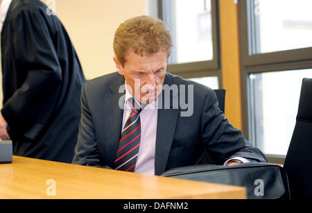 German Football association (DFB) referee Michael Kempter sits next to ...