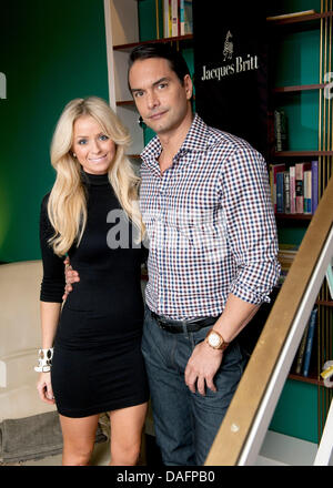 Swedish top model Marcus Schenkenberg poses with his US American girlfriend Dorin in Berlin, Germany, 24 November 2011. Photo: Joerg Carstensen Stock Photo