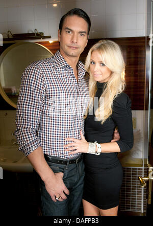 Swedish top model Marcus Schenkenberg poses with his US American girlfriend Dorin in Berlin, Germany, 24 November 2011. Photo: Joerg Carstensen Stock Photo