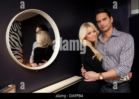 Swedish top model Marcus Schenkenberg poses with his US American girlfriend Dorin in Berlin, Germany, 24 November 2011. Photo: Joerg Carstensen Stock Photo