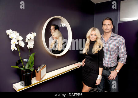 Swedish top model Marcus Schenkenberg poses with his US American girlfriend Dorin in Berlin, Germany, 24 November 2011. Photo: Joerg Carstensen Stock Photo