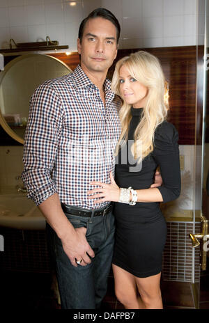 Swedish top model Marcus Schenkenberg poses with his US American girlfriend Dorin in Berlin, Germany, 24 November 2011. Photo: Joerg Carstensen Stock Photo