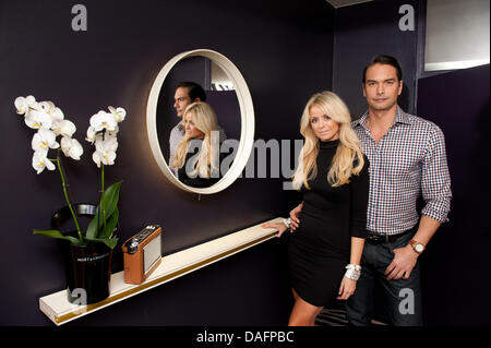 Swedish top model Marcus Schenkenberg poses with his US American girlfriend Dorin in Berlin, Germany, 24 November 2011. Photo: Joerg Carstensen Stock Photo