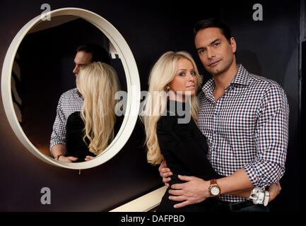 Swedish top model Marcus Schenkenberg poses with his US American girlfriend Dorin in Berlin, Germany, 24 November 2011. Photo: Joerg Carstensen Stock Photo