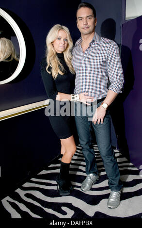 Swedish top model Marcus Schenkenberg poses with his US American girlfriend Dorin in Berlin, Germany, 24 November 2011. Photo: Joerg Carstensen Stock Photo