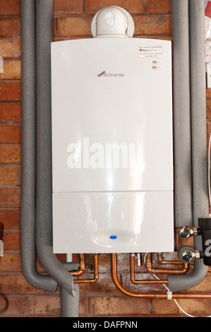 Gas combi boiler made by Worcester 30si heats water & central heating radiators, UK. Stock Photo
