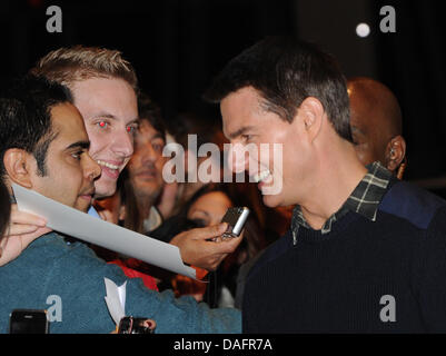 US actor Tom Cruise is surrounded by fans during the German premiere of his movie 'Mission: Impossible - Ghost Protocol' at the BMW World in Munich, Germany, 09 December 2011. The movie will be aired on 15 December 2011. Photo: Ursula Dueren Stock Photo