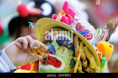 A carnevalist celebrates at the old market (Alter Markt) in Cologne, Germany, 03 March 2011. Fat Thursday marks the start of carnival, that is celebrated on the streets. Photo: Rolf Vennenbernd Stock Photo