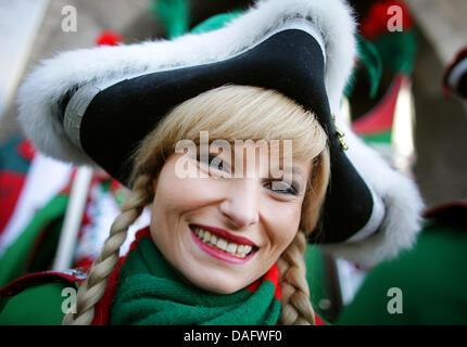 A dancer of the Rhenish carneval is pictured at the old market (Alter Markt) in Cologne, Germany, 03 March 2011. Fat Thursday marks the start of carnival, that is celebrated on the streets. Photo: Rolf Vennenbernd Stock Photo