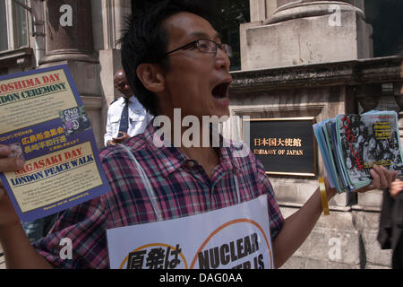 London, UK. 12 July 2013, London.  A man shouts his message to the public during a vigil outside the Japanese embassy in London protesting against nuclear power. Credit:  Paul Davey/Alamy Live News Stock Photo