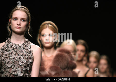 Models present creations by Italian  fashion house Valentino during the Paris Fashion Week Fall-Winter 2011/12 Ready-to-wear collection, in Paris, France on 08 March 2011. The fashion week runs from 01 March to 09 March. Photo: Hendrik Ballhausen Stock Photo