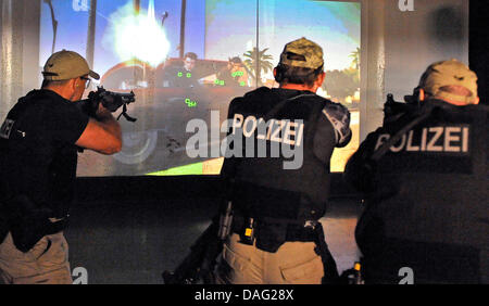 A file picture taken on 19 June 2010 shows police during a shooting exercise during an Open Door day at the Federal Crime Agency in Wiesbaden, Germany. The Federal Crime Agency celebrates it's 60 years jubilee, but the employees are not altogether happy. A possible fusion with the Federal German Police is still under discussion. Photo: Marius Becker Stock Photo