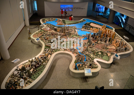 Tourists photograph at scale model of Singapore central district Stock Photo