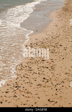 sea on beach with sand and pebbles Stock Photo