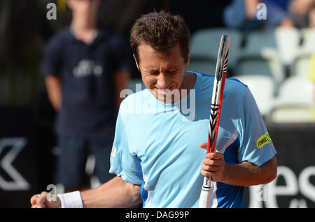 Stuttgart, Germany. 12th July, 2013. Germany's Philipp Kohlschreiber reacts after defeating France's Monfils during the quarter final match at the ATP Tournament in Stuttgart, Germany, 12 July 2013. Photo: MARIJAN MURAT/dpa/Alamy Live News Stock Photo