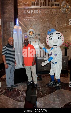 Manhattan, New York, USA. 12th July, 2013. Baseball Hall of Famer OZZIE SMITH, NY Mets Legend MOOKIE WILSON and MR. MET light the Empire State Building 'NY Mets Blue and Orange' to celebrate the start of MLB All-Star Week. Credit:  Bryan Smith/ZUMAPRESS.com/Alamy Live News Stock Photo