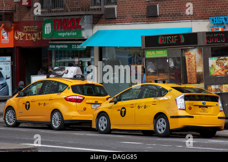 Modern NYC Medallion Cabs, better known as Yellow Cabs, parked in the Murray Hill neighborhood of Manhattan, New York, NY, USA. Stock Photo