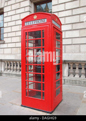 Traditional red telephone box in London UK Stock Photo