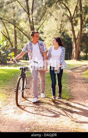 beautiful young teenage couple walking at the park Stock Photo
