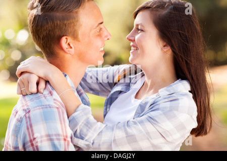 close up portrait of teenage couple looking at each other with love Stock Photo