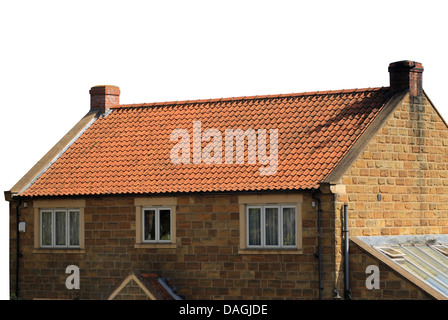 Exterior of brick house with red roof tiles isolated on white background. Stock Photo