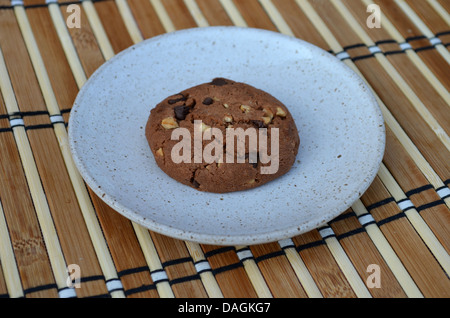 Single cookie on a plate Stock Photo