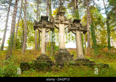 Three stone Celtic crosses in the woods Stock Photo